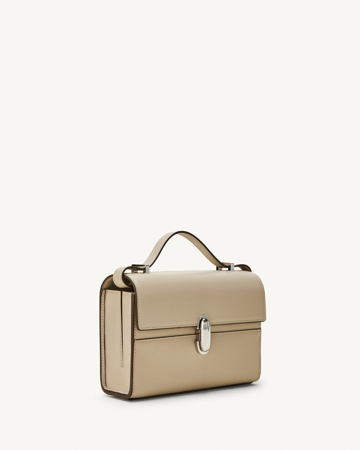 side view of bone beige bag with silver clasp on a white background