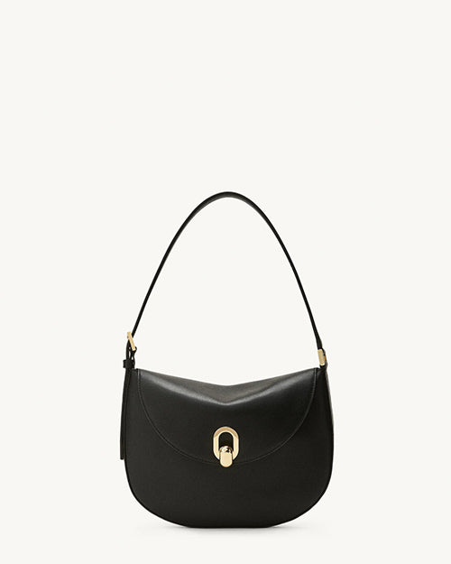 front view of a black bag with gold hardware on a white background